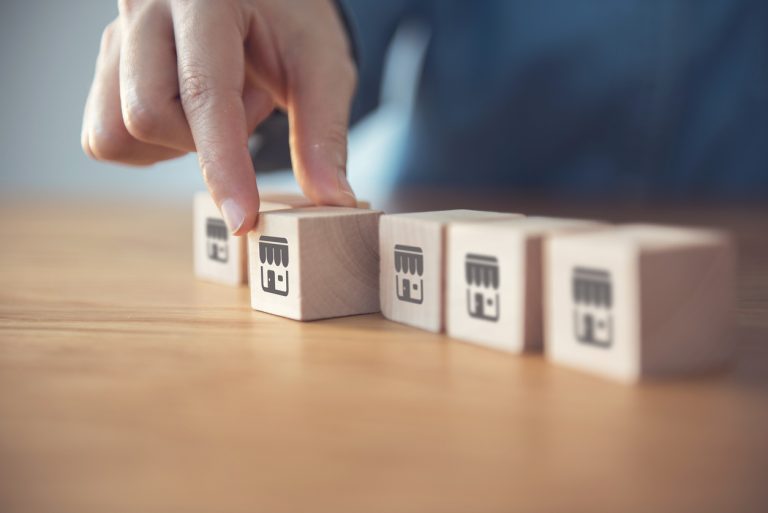 Hand choose wood blog with franchise icon. Franchise business concept